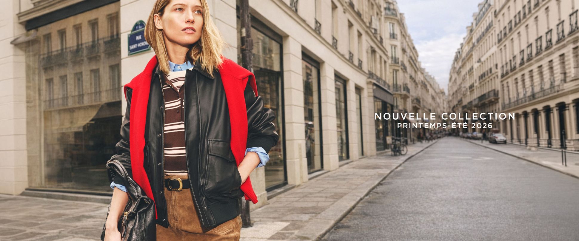 Fashion model in urban setting wearing layered outfit with red jacket. Text reads "Nouvelle Collection Printemps-Été 2026."