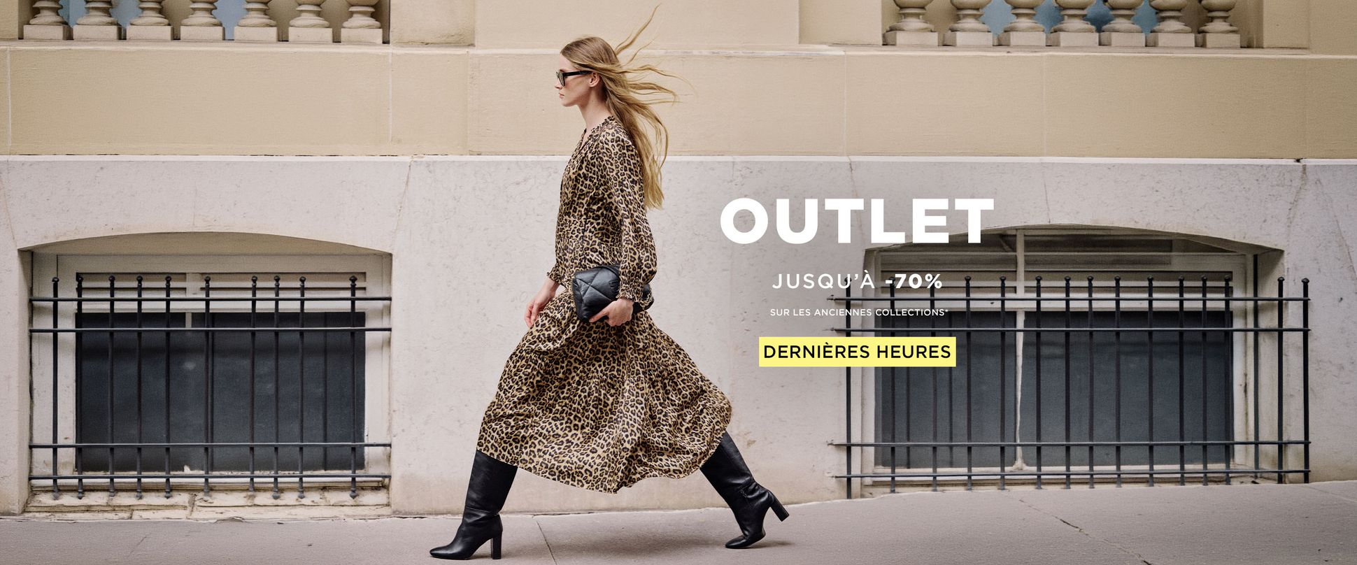 A woman in a leopard print coat and black boots walks past a building. The text reads, "OUTLET, Up to 70% off, Last hours."
