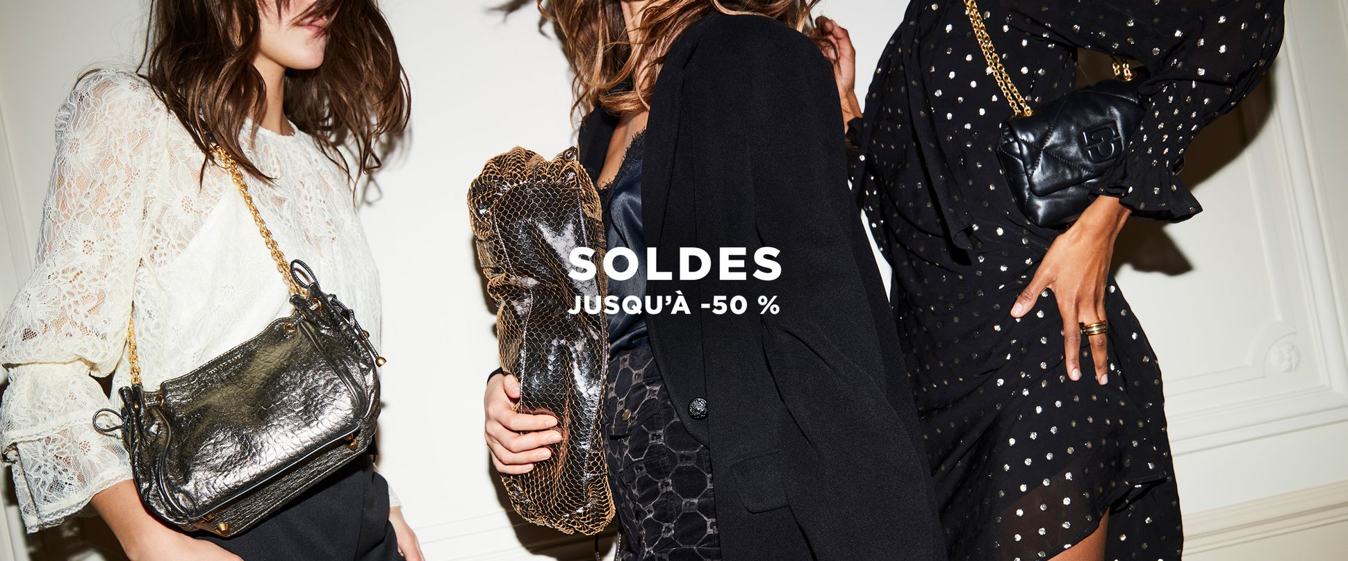 Women dressed for a party holding bags with the sales text across the front