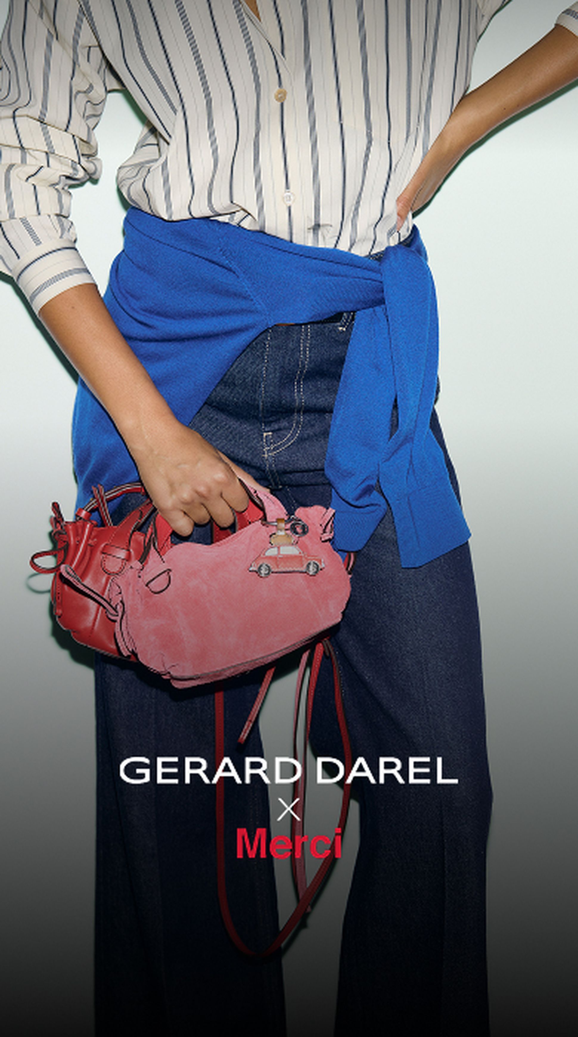 A person wearing a striped shirt and jeans with a blue sweater tied at the waist, holding a red handbag. Text: Gerard Darel x Merci.