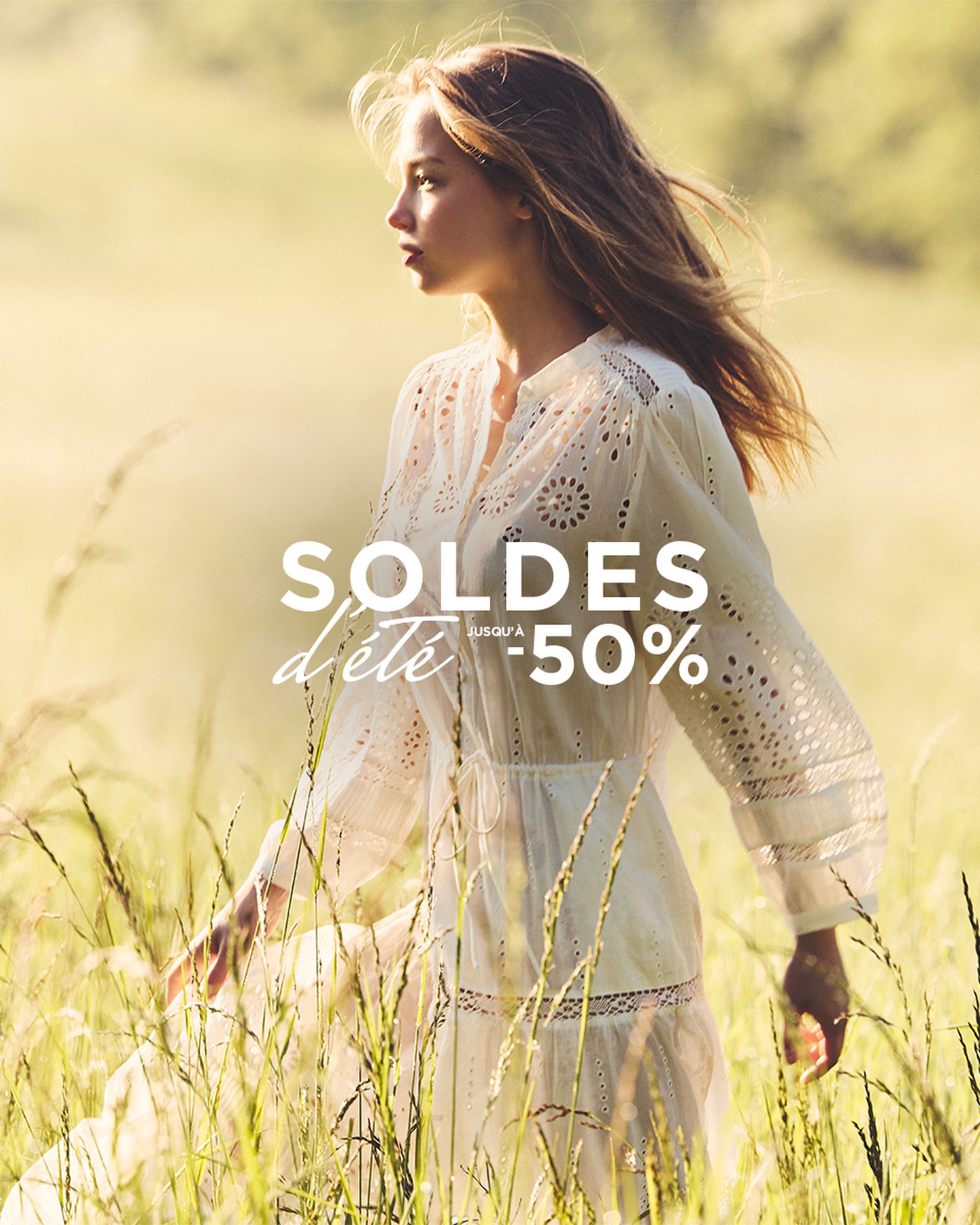 Woman in a light dress walks through a sunny meadow, text overlay reads "Soldes d'été jusqu'à -50%" indicating a summer sale.
