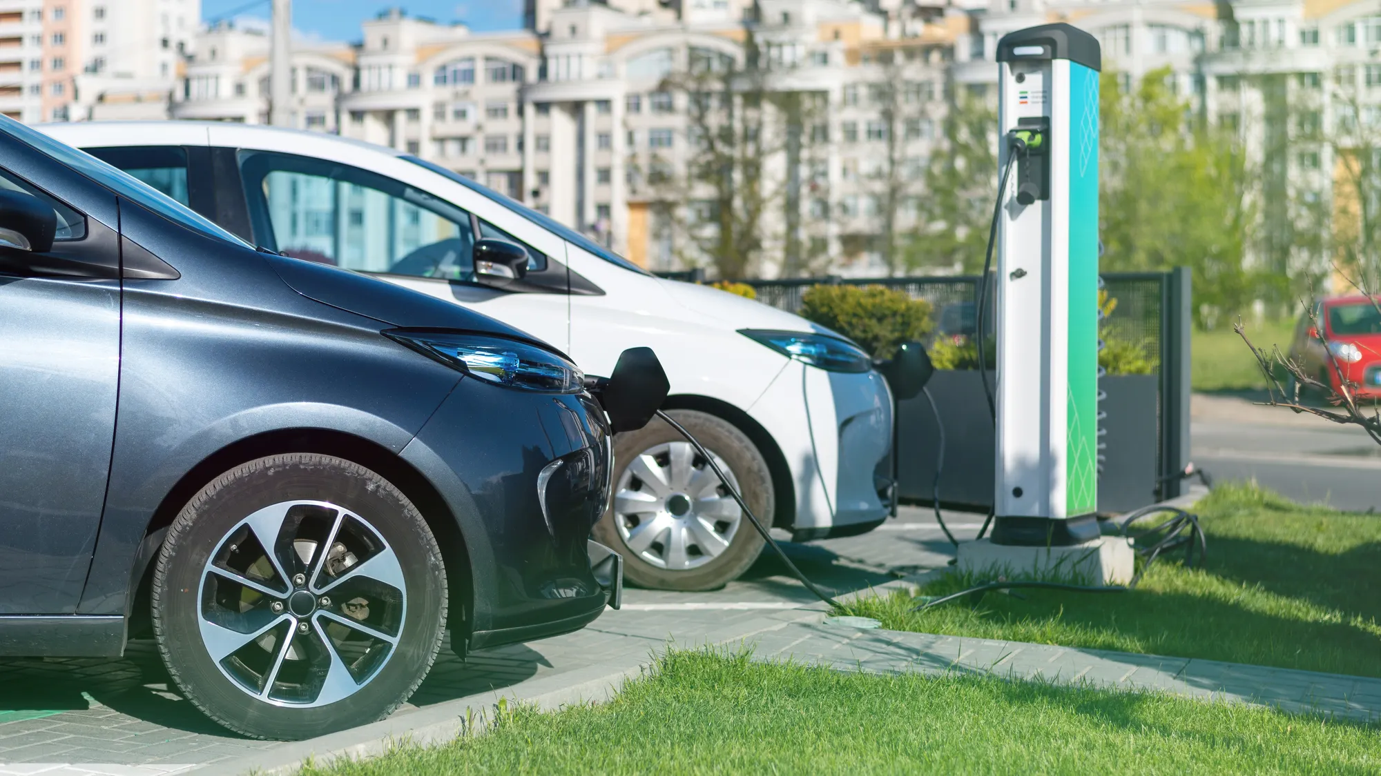 two-charging-electric-cars-charge-station-city