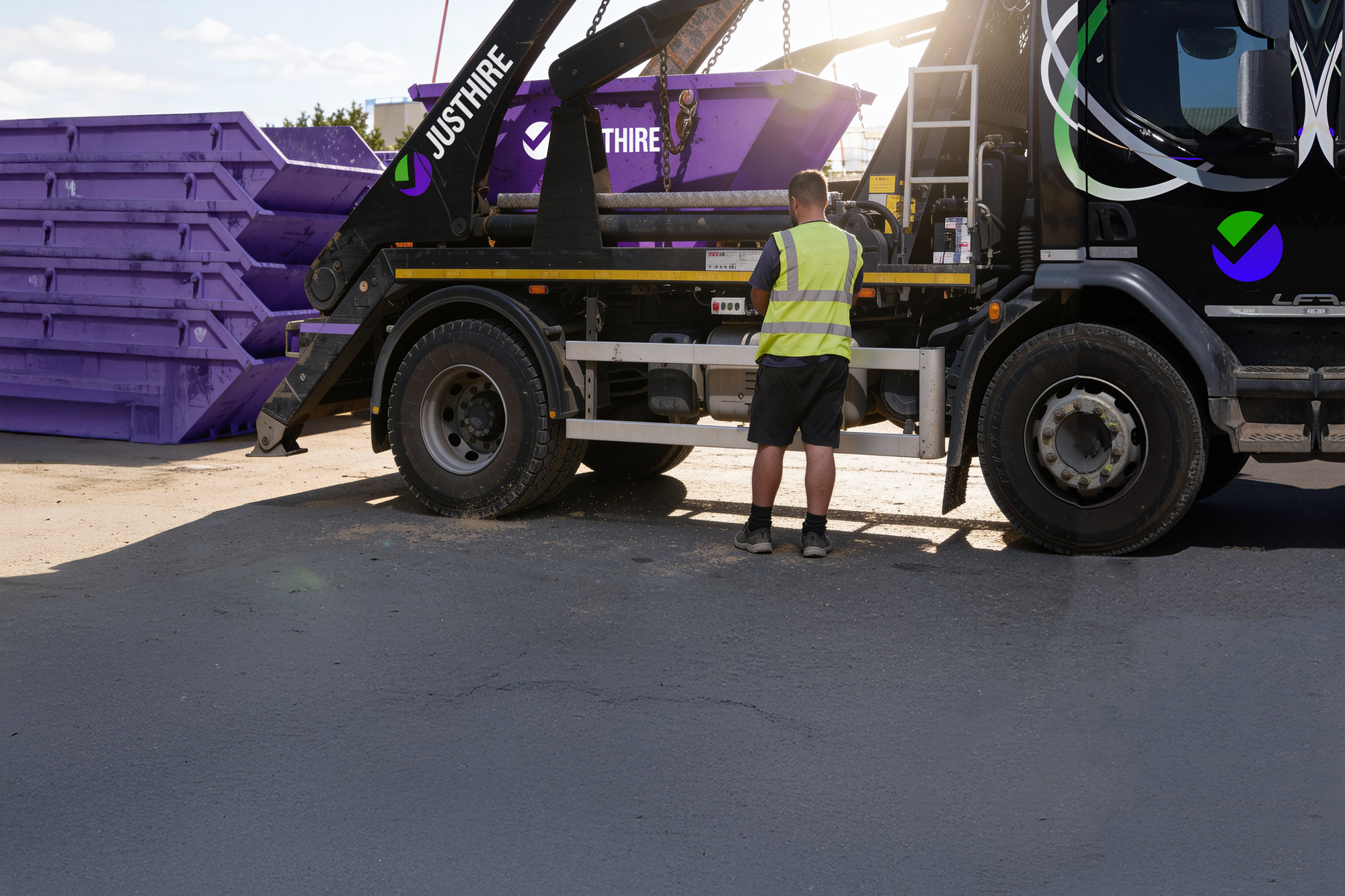 Justhire Skip Lorry With Purple Skip On The Lorry
