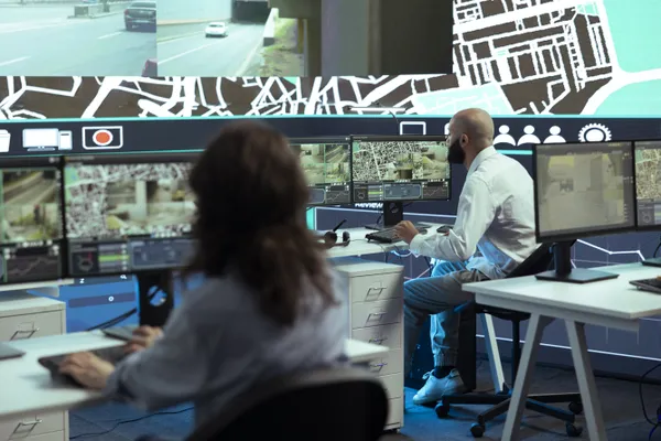 Two People In Office Monitoring Cctv