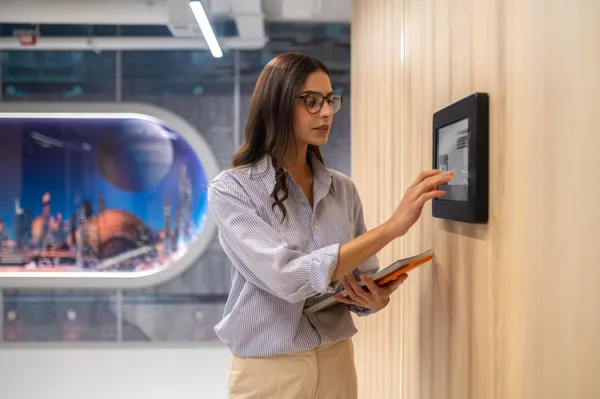 Woman Touching Control Panel Wall Corridor