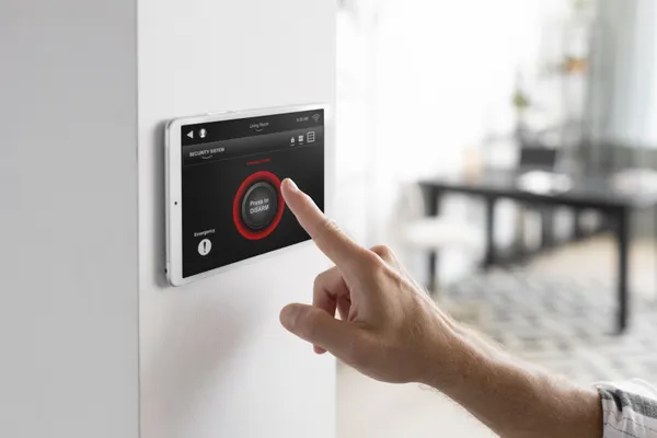 Man Using Alarm System