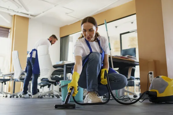 Cleaning Service Person Using Vacuum Cleaner Office