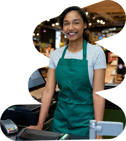 small business owner smiling at point of sale