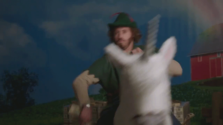 GIF Person wirft Geld auf Einhorn