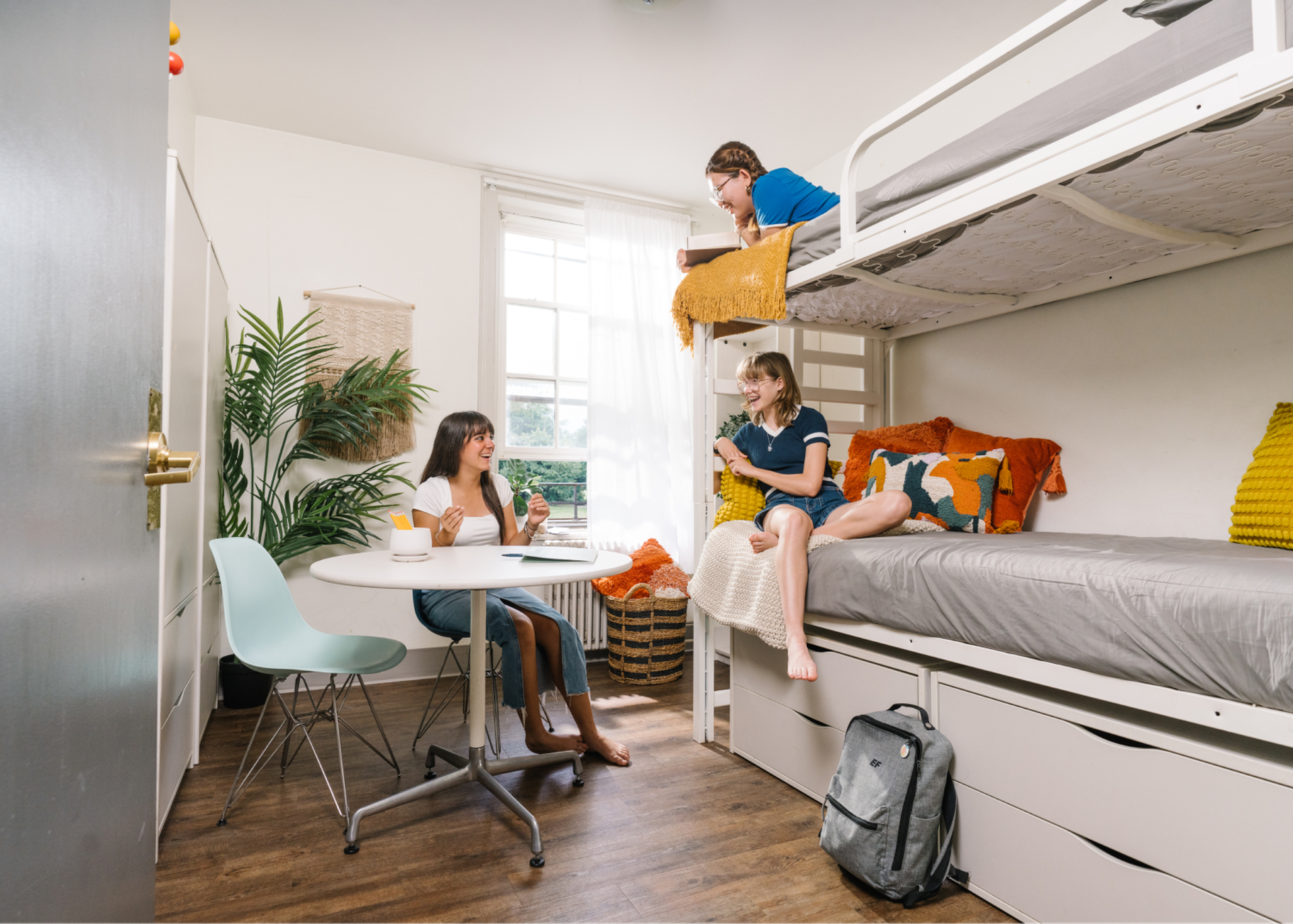Students Talking In Dorm Room
