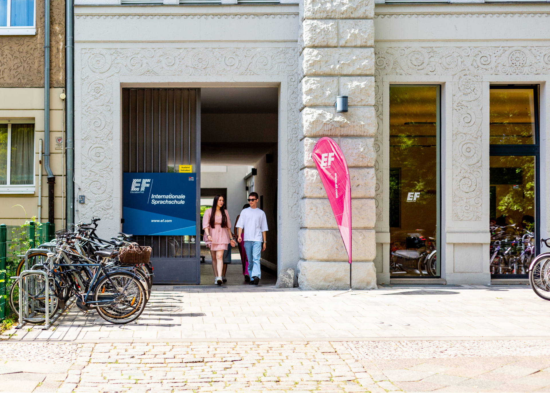 Students At Campus Entrance