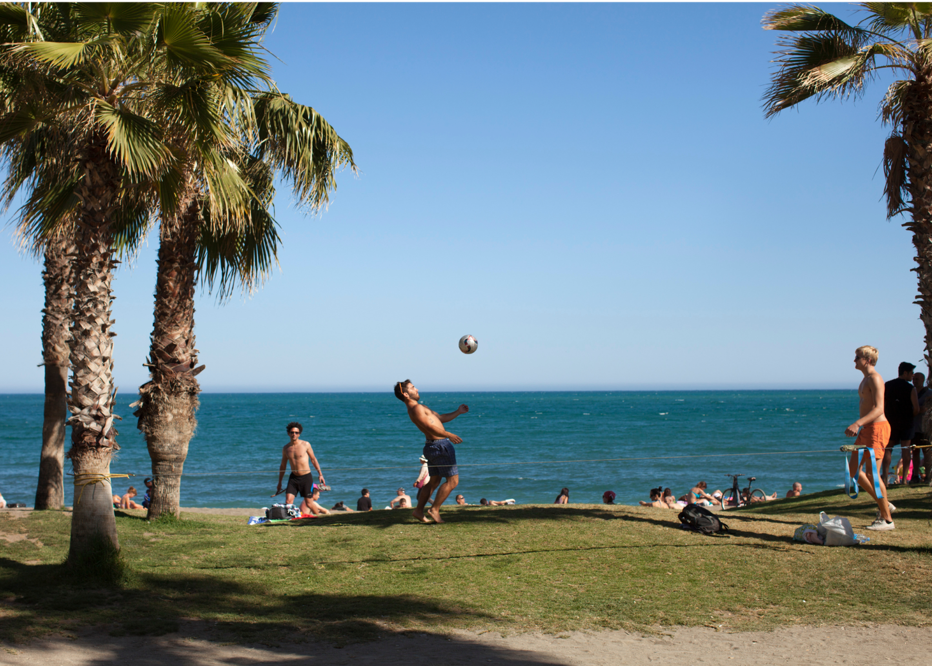 Students Playing By Beach