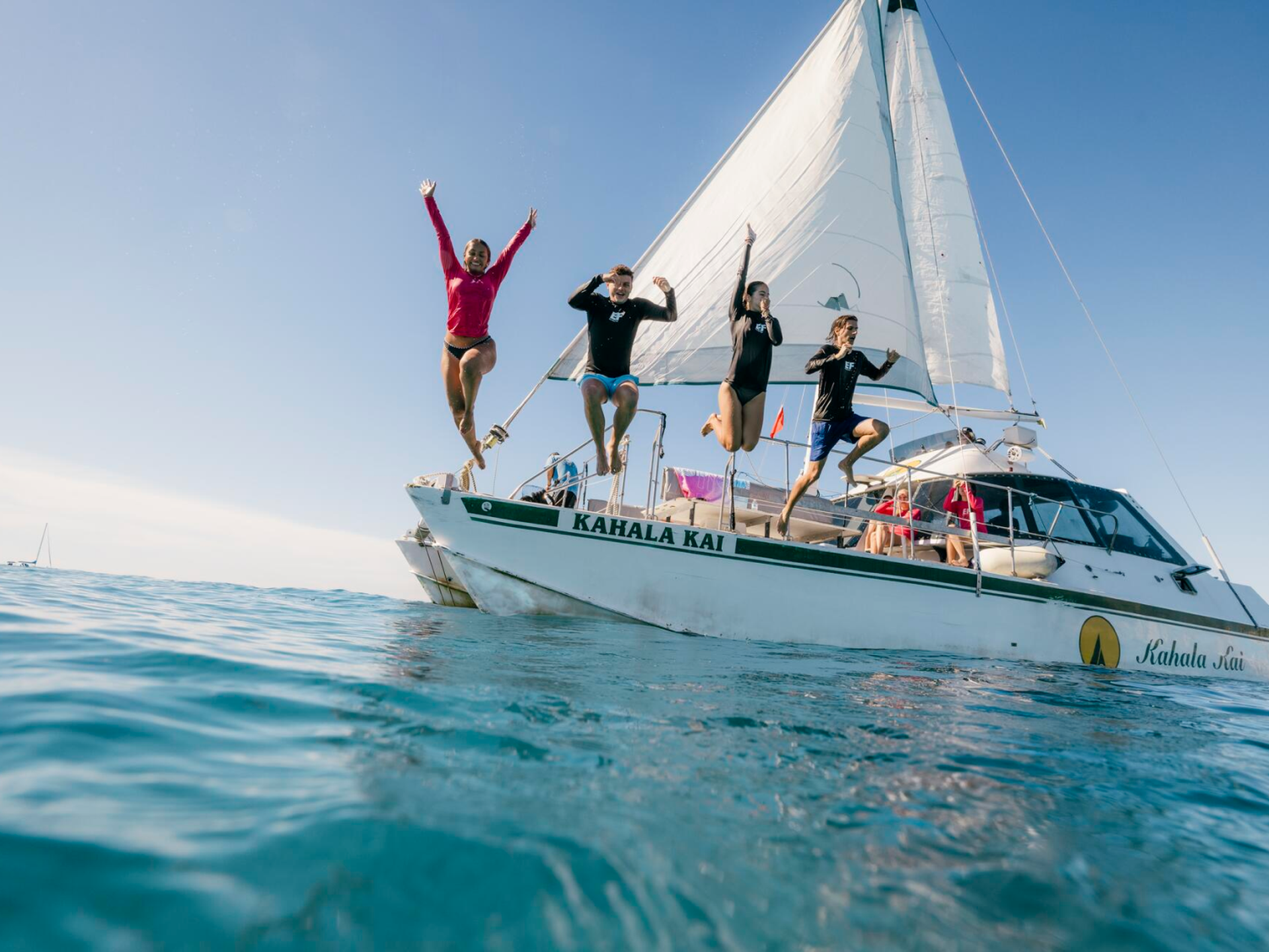 Students Jumping Into Water