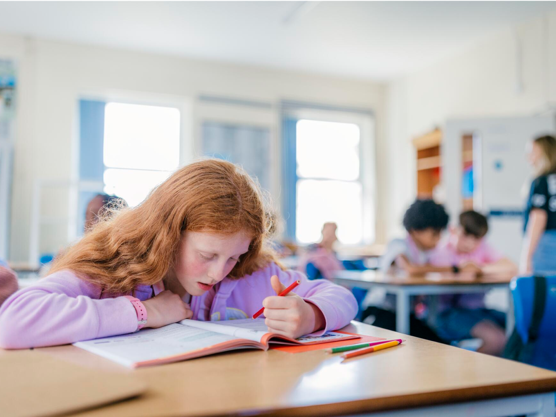 Students Studying In Classroom
