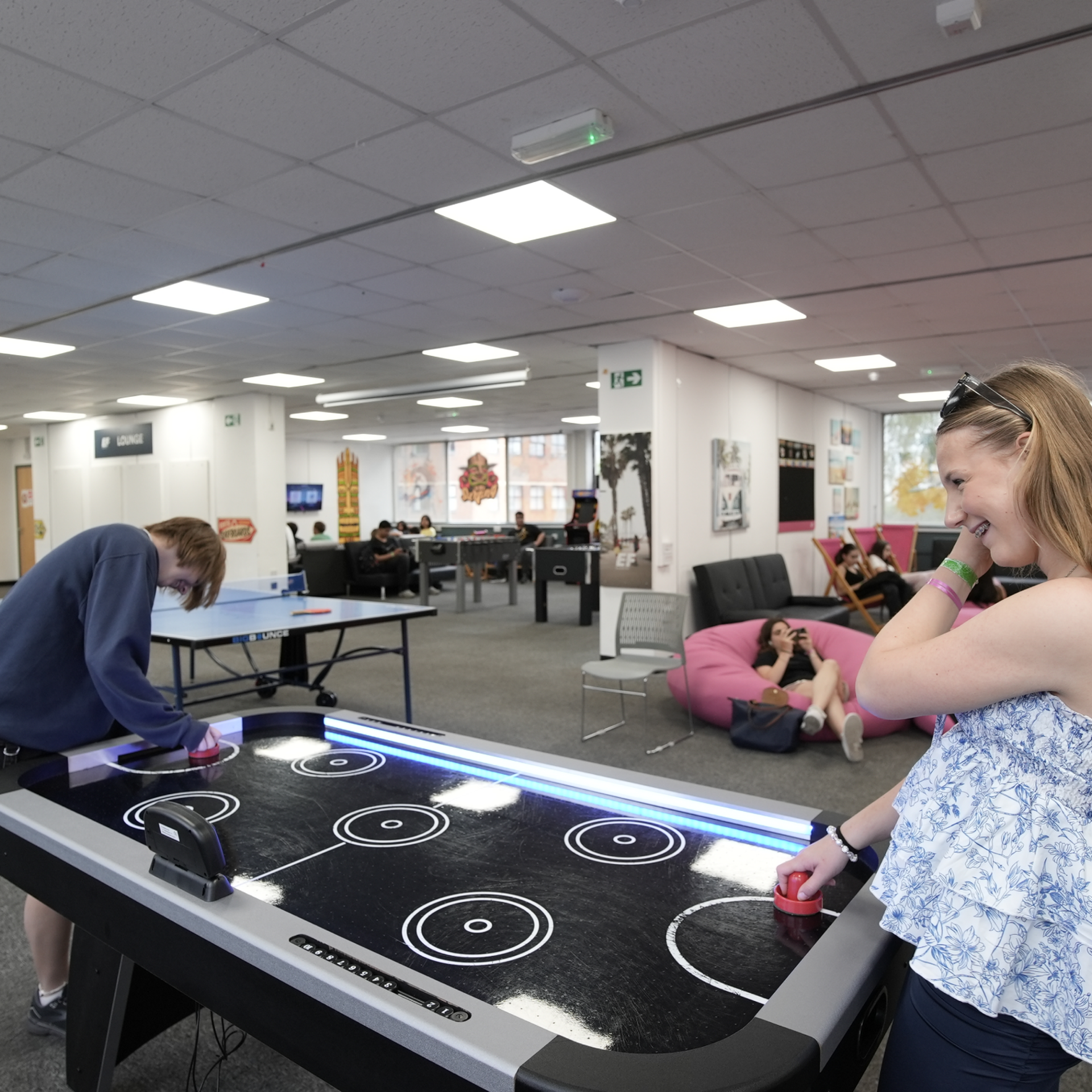 Students playing air hockey