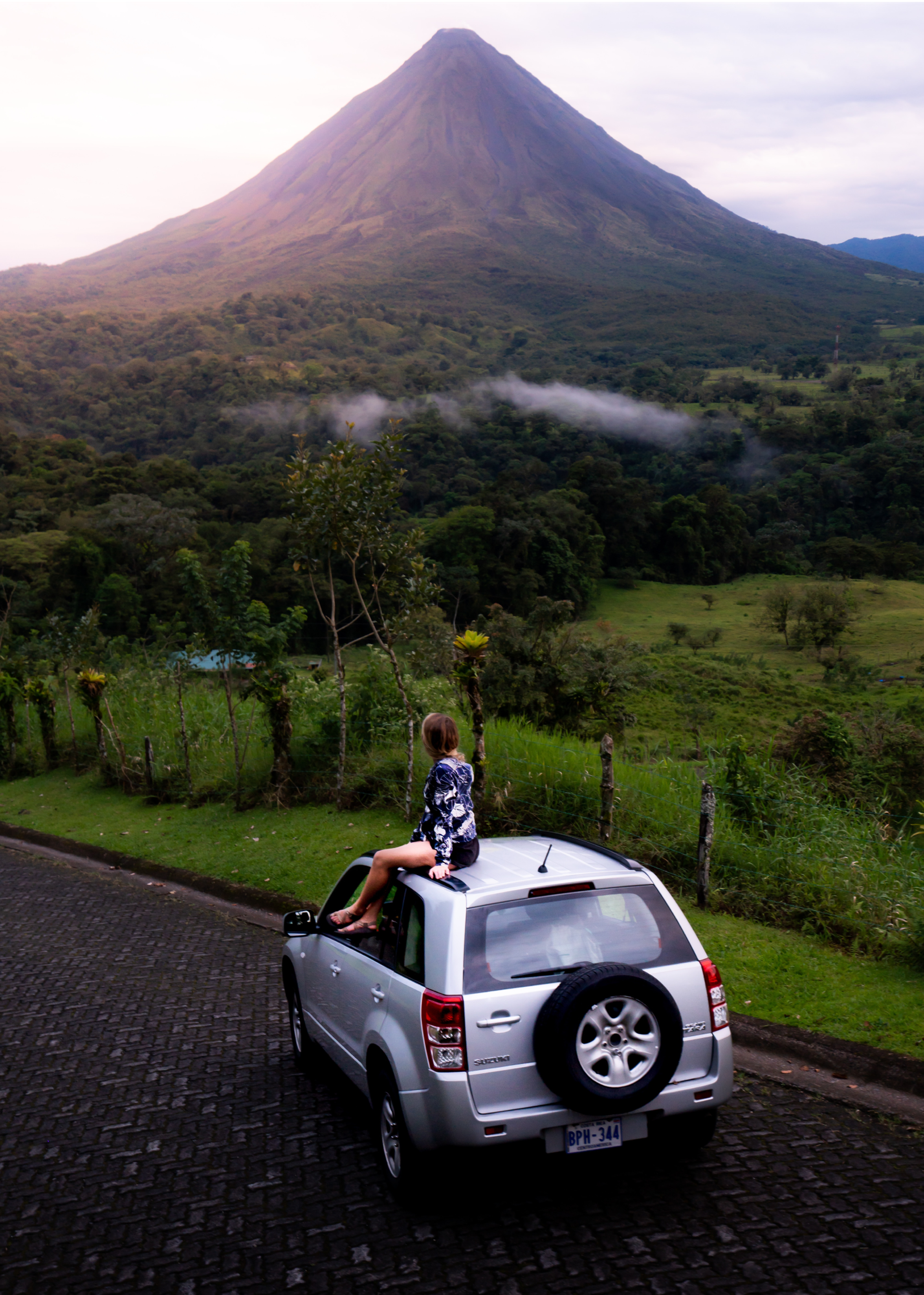 Woman Sitting On Car