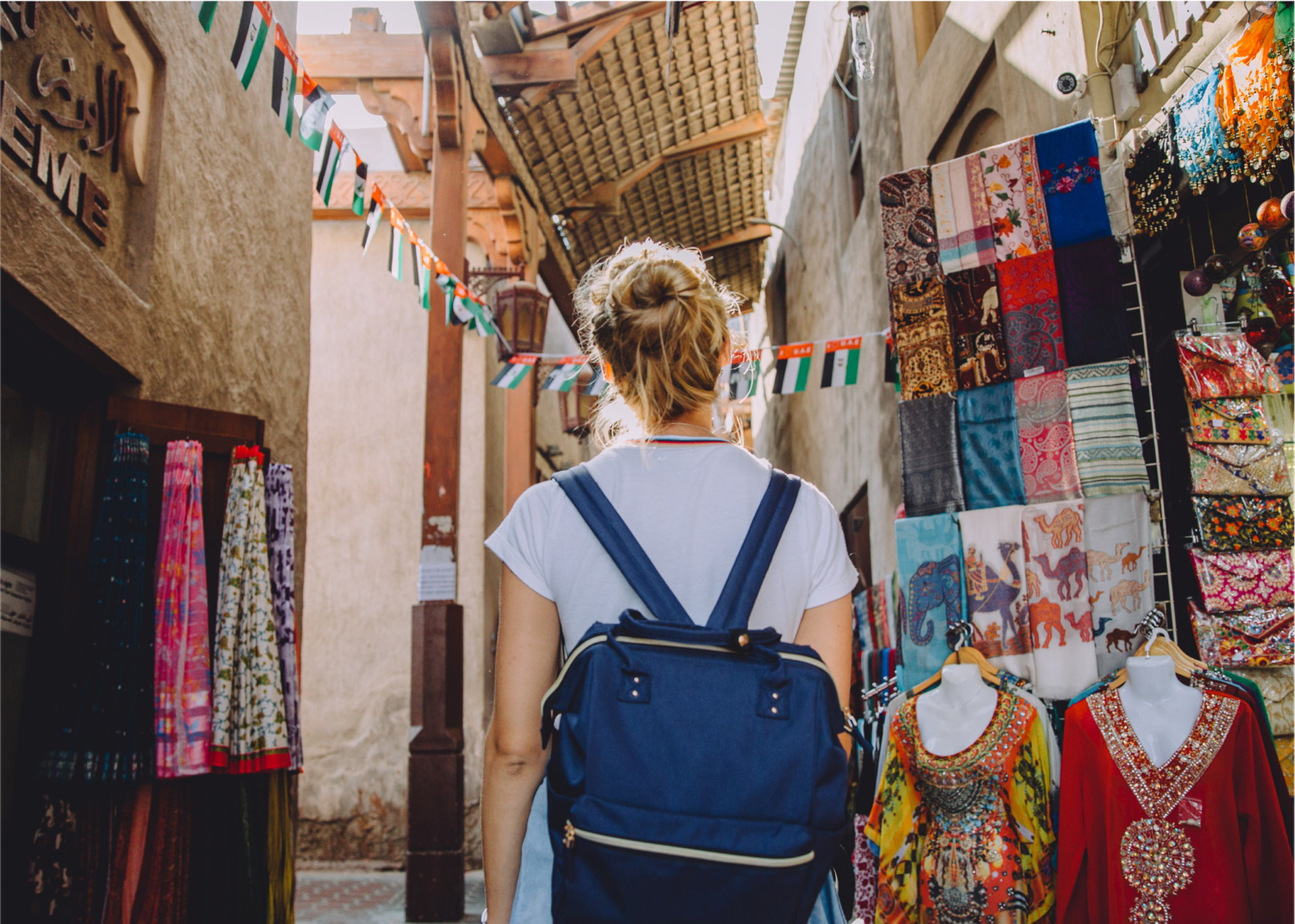 student walking through old town in Dubai
