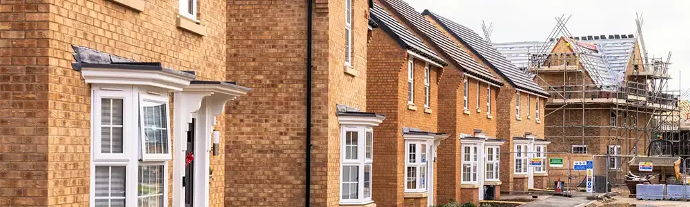 Row of new build houses some ready to move into and some in construction