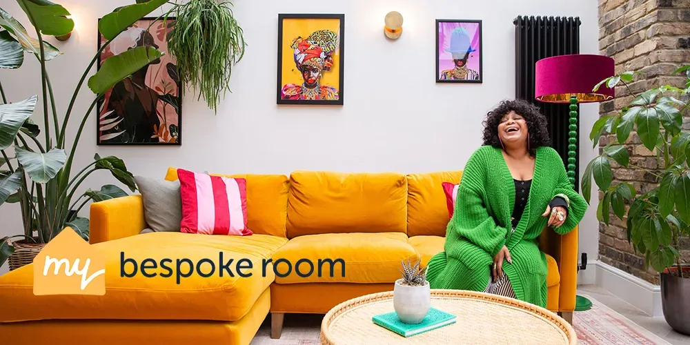 Smiling woman in a vibrant living room with a yellow sofa, green plants, colorful artwork, and a "my bespoke room" logo overlay.