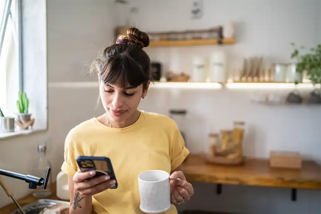 homeowner looking at the mortgage rates ahead of remortgaging her house