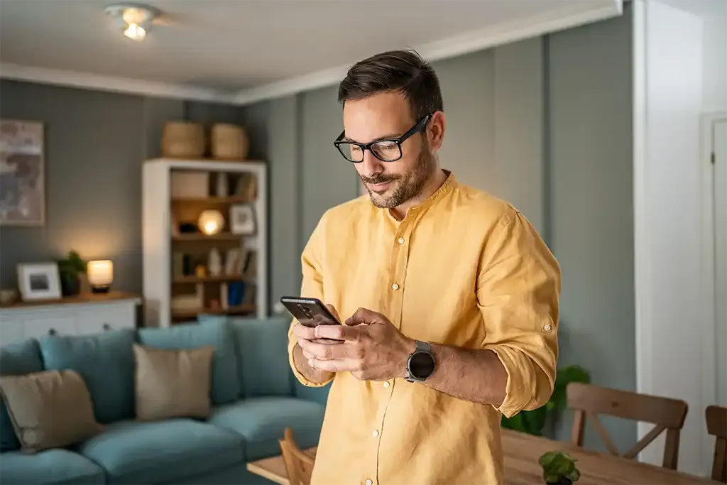 homeowner reviewing his remortgaging conveyancing documents on his phone