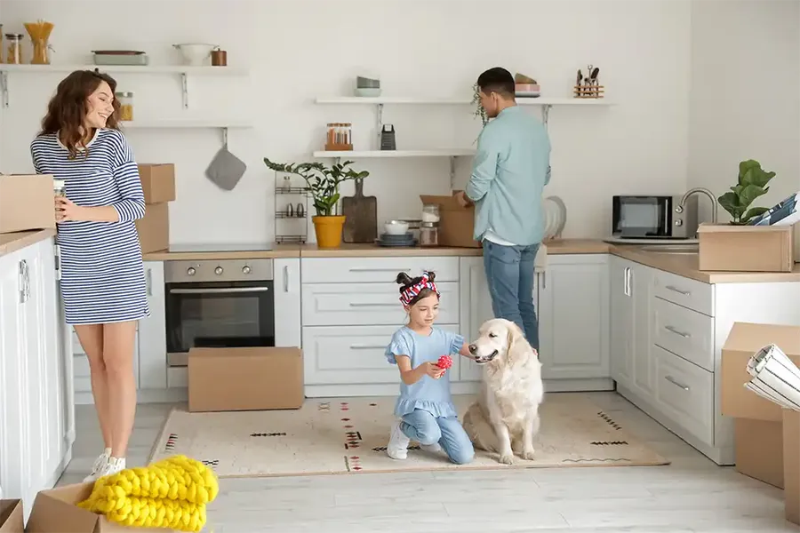 young family unpacking after a successful move into their new home