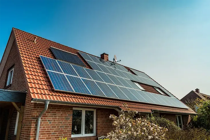 sustainable house with solar panels bought using a green mortgage