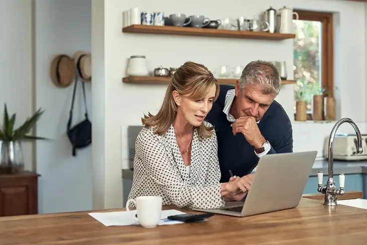 couple looking at how to downsize now that their kids have left the nest