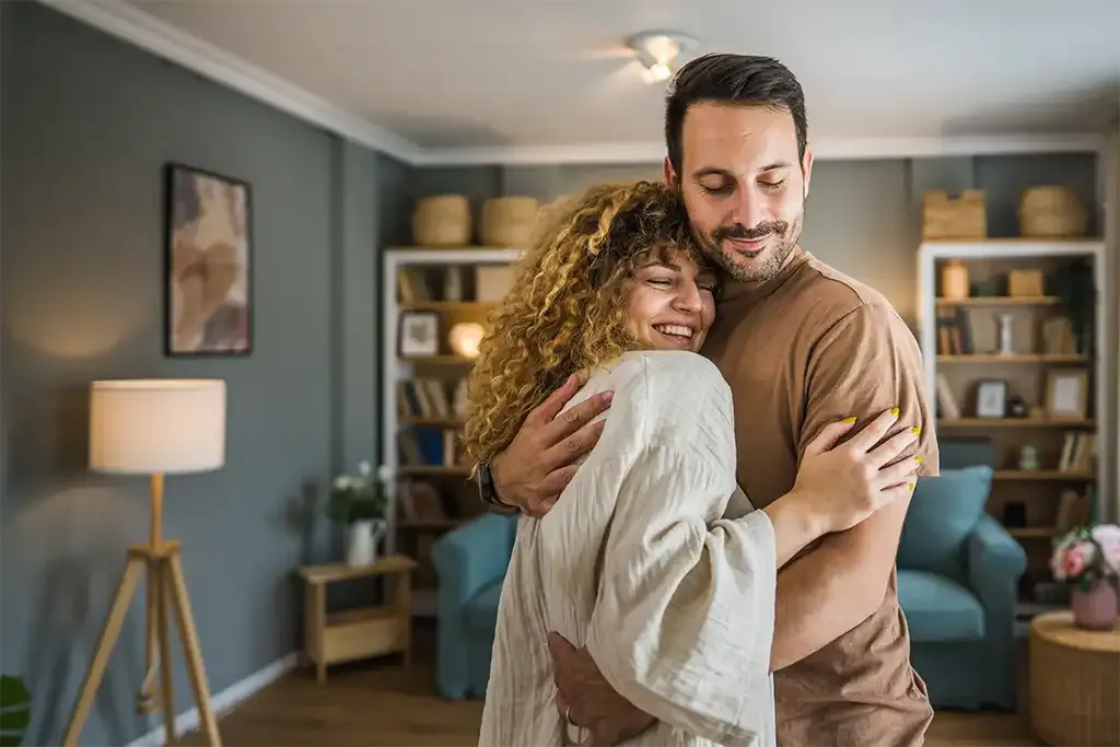 a couple celebrating moving into their new home