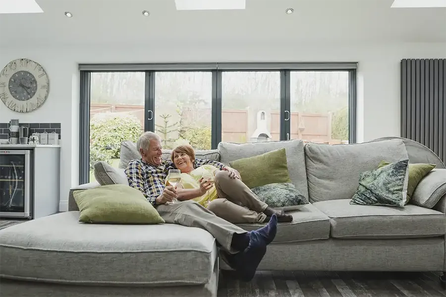 a couple at home discussing their equity release options