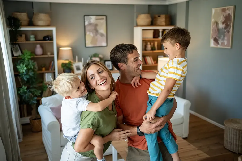 family happy and smiling in their new home