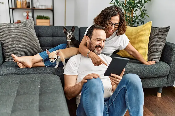 middle aged couple looking at housing options wondering if its the right time to downsize