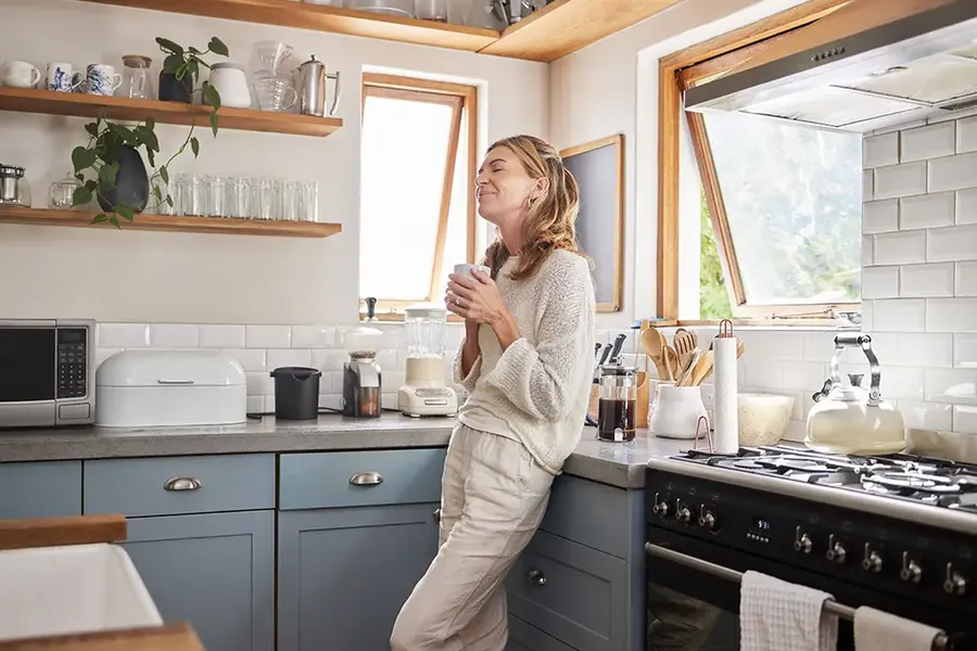 woman happy and relaxed in her new home