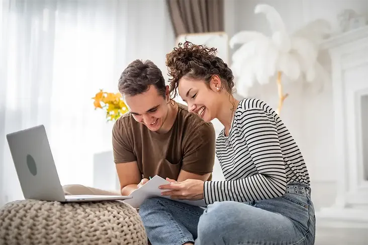 young homeowners looking at how to remortgage their help to buy home