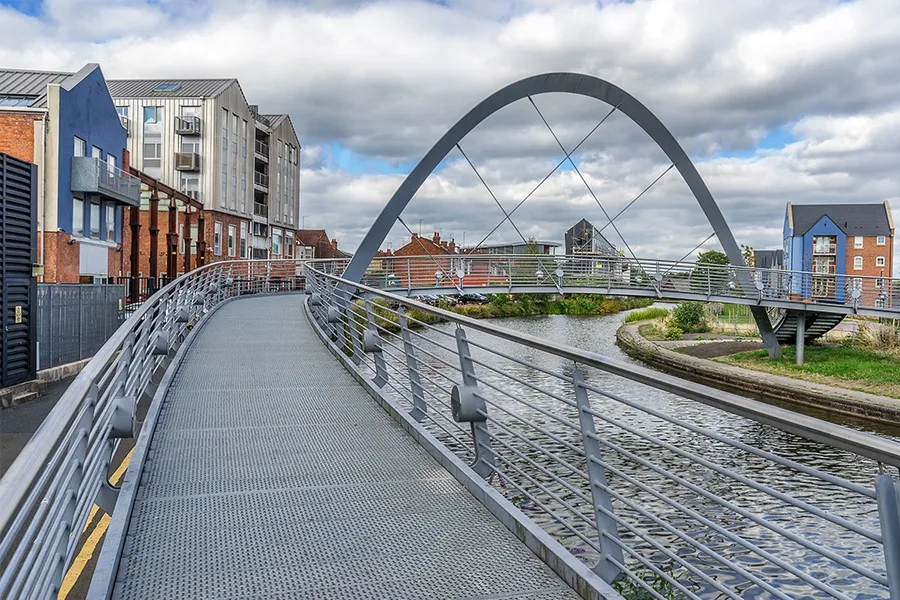 Flats and bridge on Electric Wharf, Coventry, West Midlands, England