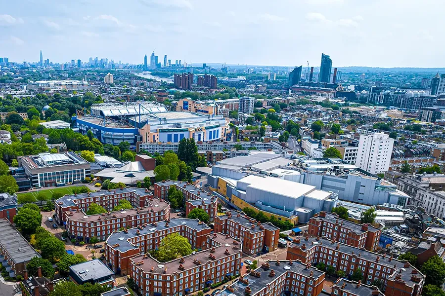aerial view of a football stadium and houses in West London, England