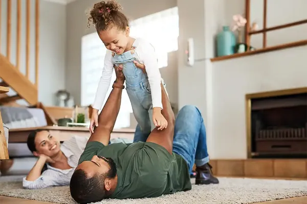 family in living room hoping for a quick house sale