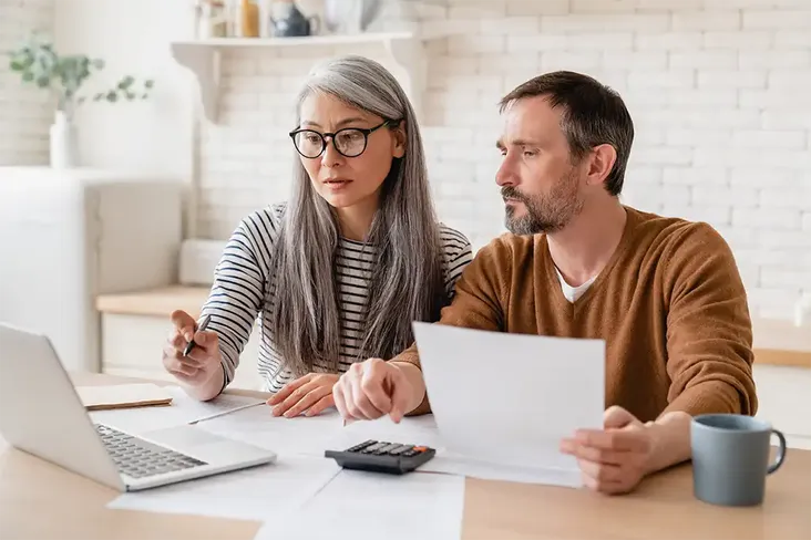 middle aged man sorting out the transfer of equity after recently getting married