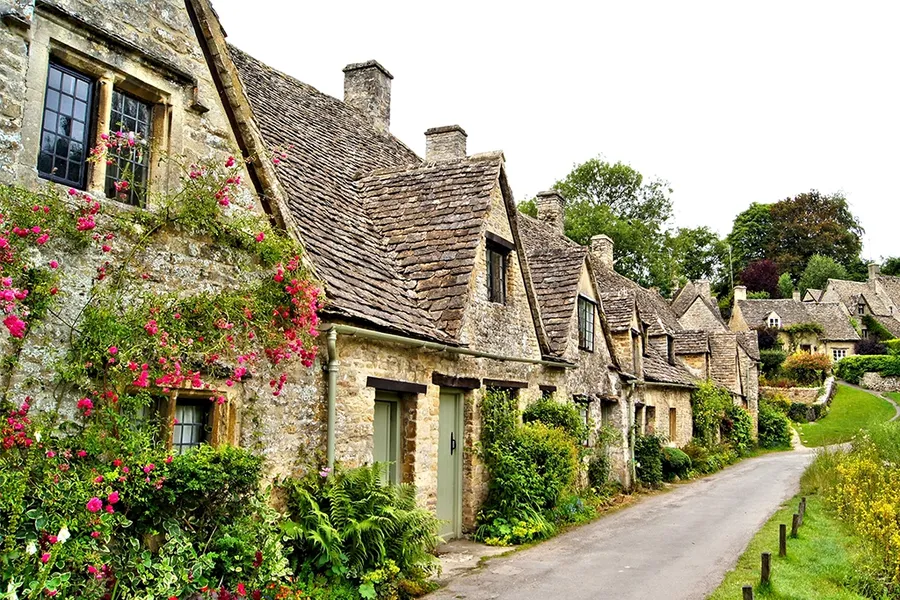 street of picturesque houses in Bibury, Gloucestershire, South West England, UK