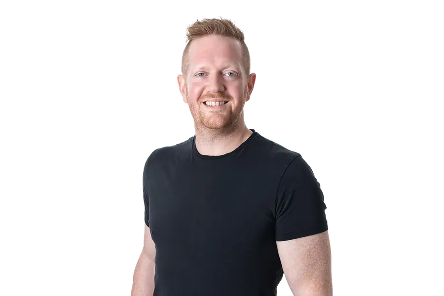 Smiling man in a black t-shirt and jeans