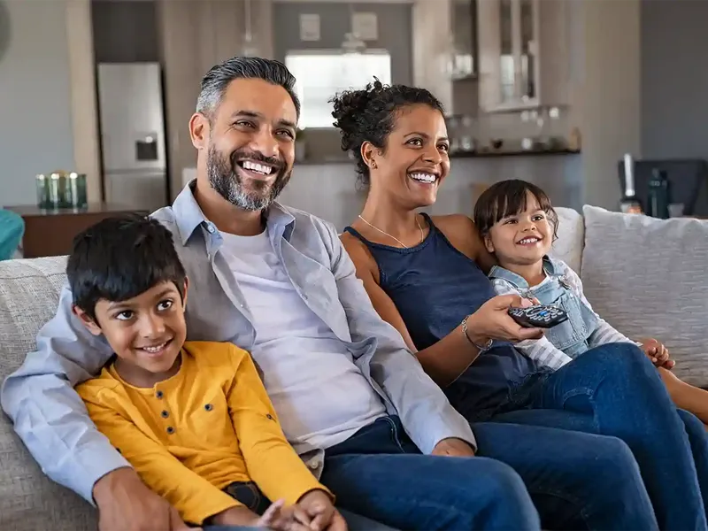 happy family relaxing in their home after remortgaging to a better deal