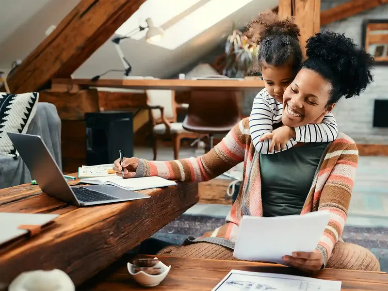 a mum looking at her moving documents at home