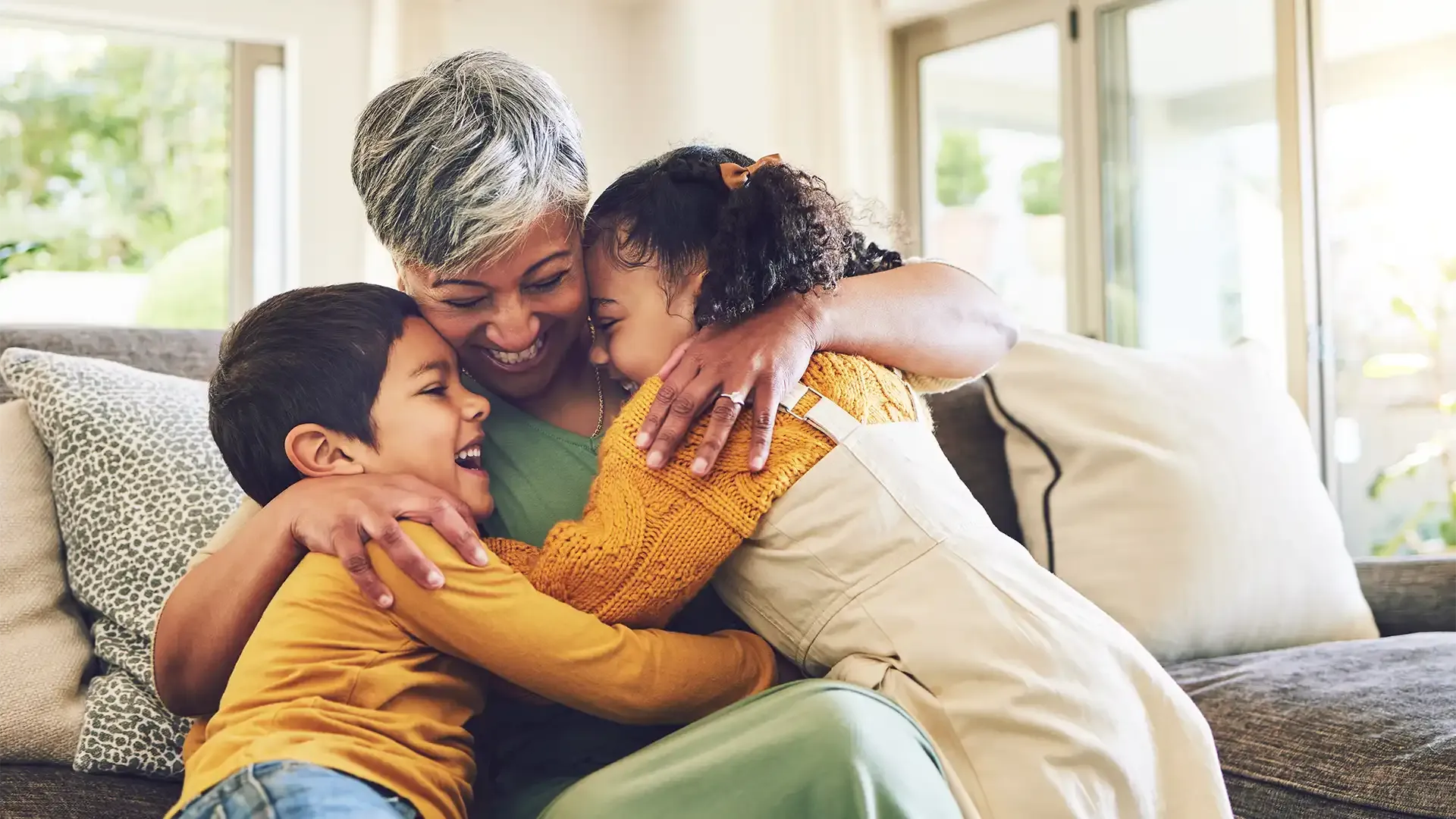 a grandma with her grandchildren celebrating completing her house purchase