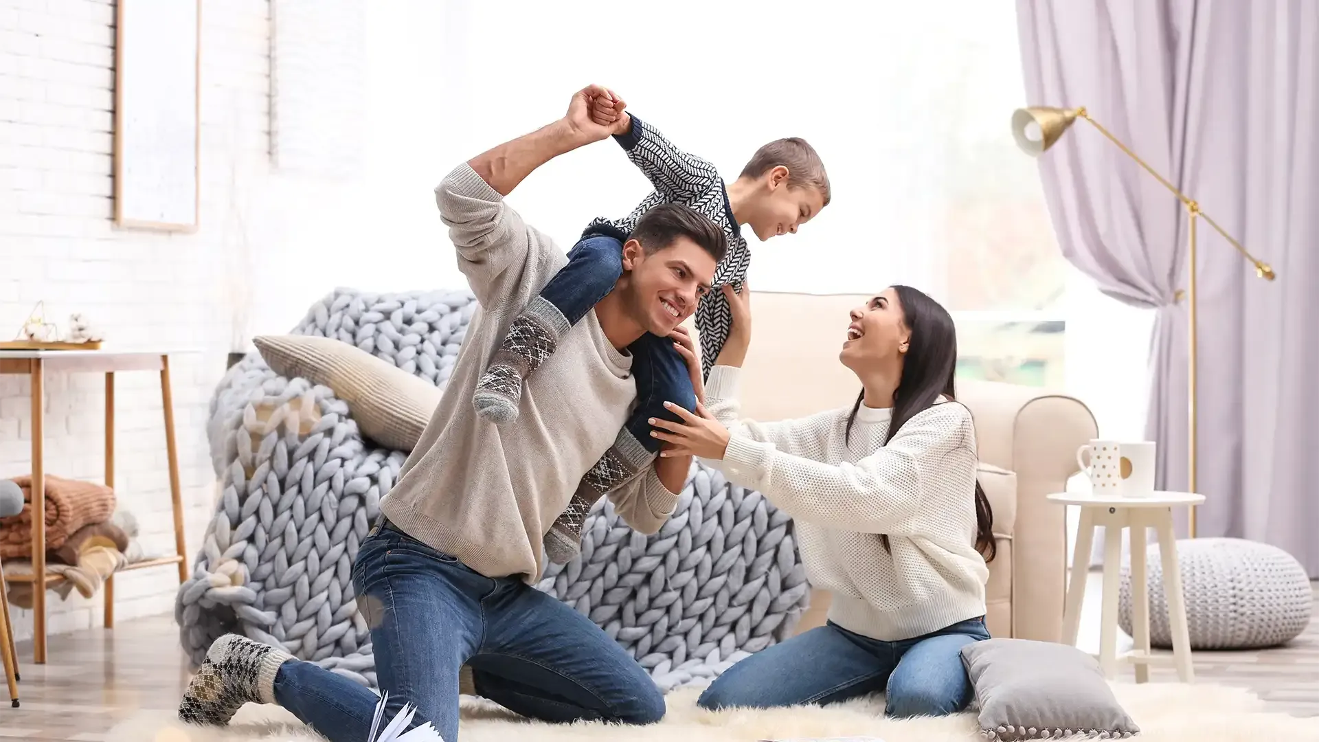 young family thinking of ways to sell their first home together so they can move into a bigger family home