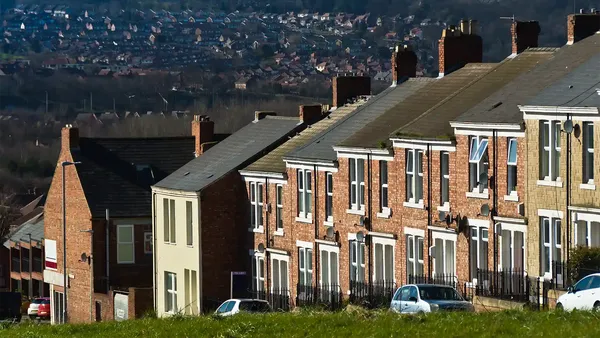 a street of houses in Gateshead with the town in the distance, North East UK
