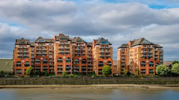 modern flats facing river Thames, Fulham, West London, UK