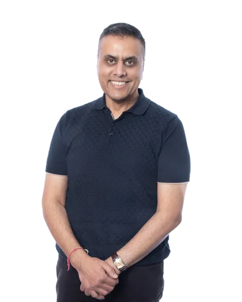 Smiling person in a navy polo shirt