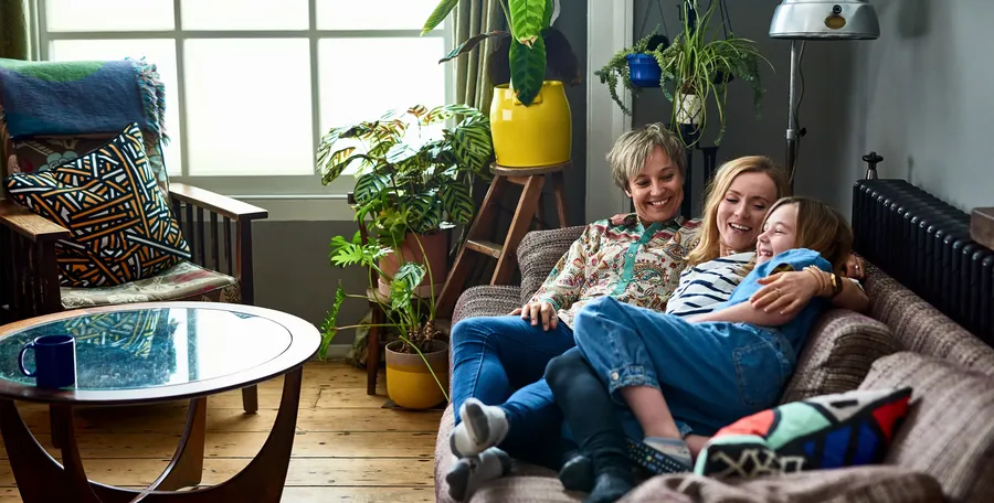 family relaxing in their new home - home page hero