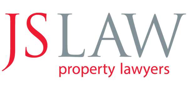 Logo with red and grey, featuring text that reads "JS LAW property lawyers"
