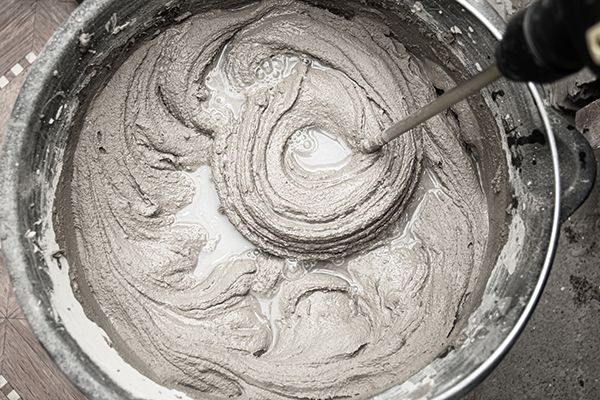 Mortar being mixed in a bucket